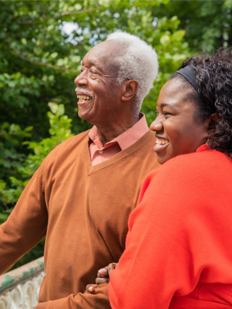 Older man and his caregiver enjoying the view