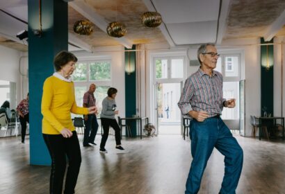 elderly man and woman dancing